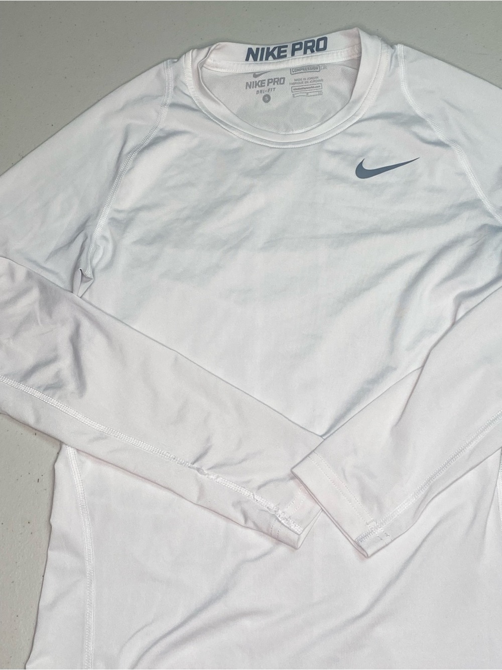 Nike White Long Sleeve Performance Top with Gray Swoosh